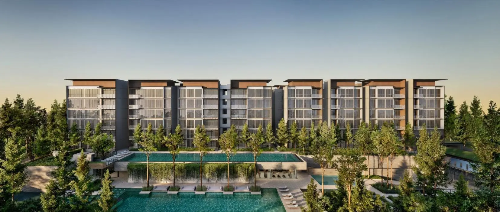 Amberwood's low blocks over the pool at dusk, the developer's artist's impression